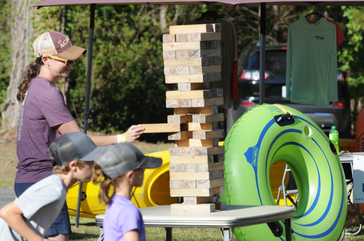 Jessi Shuler takes a turn during a game of Jenga. By Roger Lee